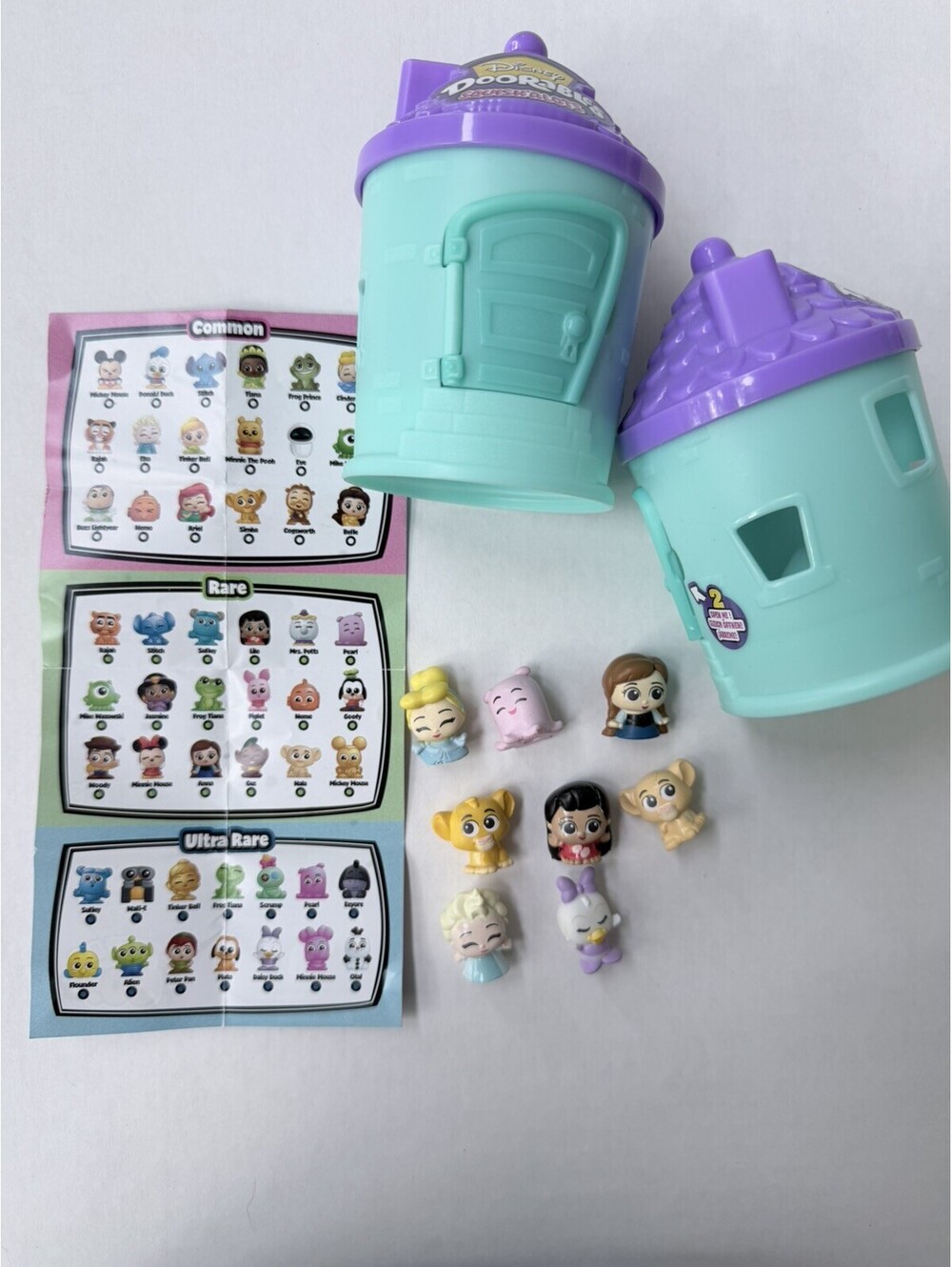 Disney doorables squishalots Mixed Lot Of 8 Mini Squishy Figures with 2 houses.